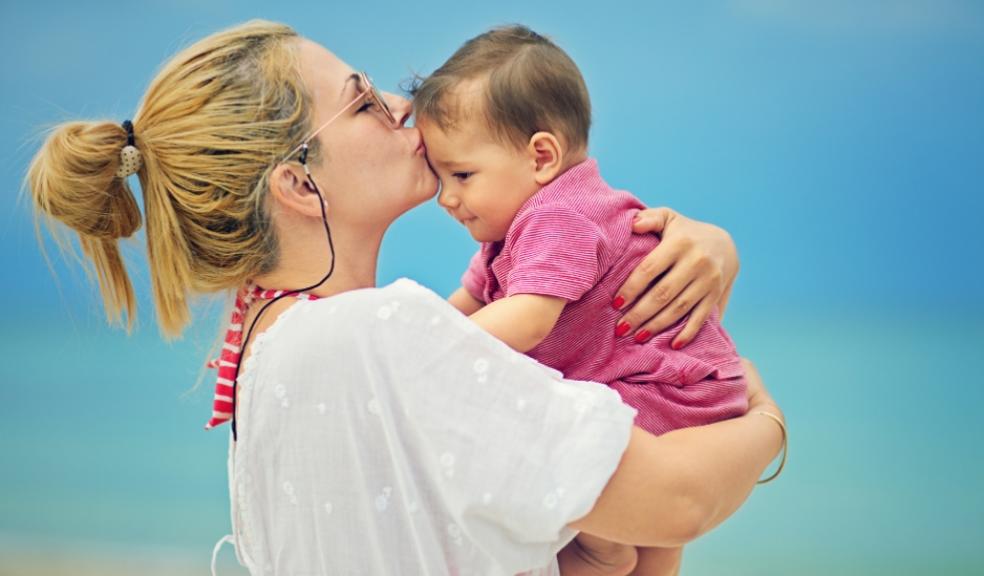 picture of mum and baby outside in the sun