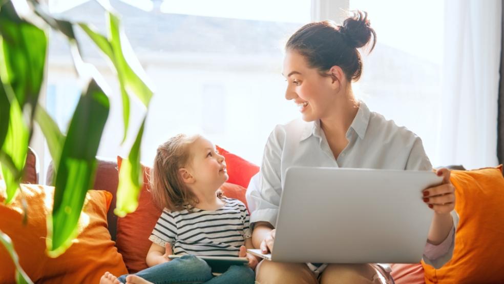 picture of mum and child looking at a laptop