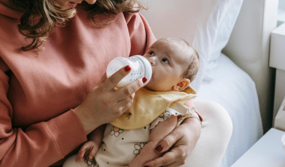 picture of a mum bottle feeding a baby