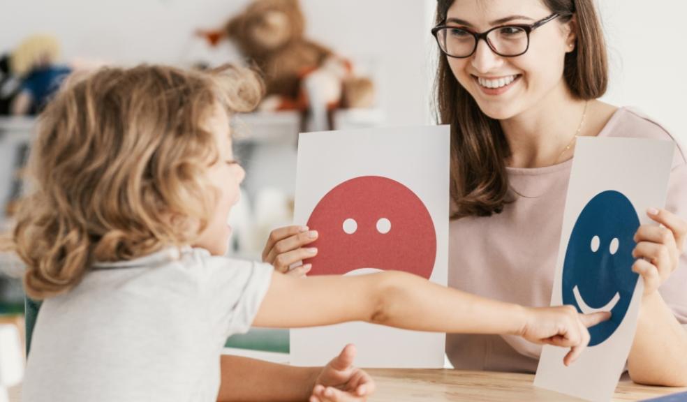 picture of mum helping autistic child express emotions
