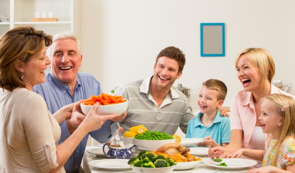 picture of a family having dinner together