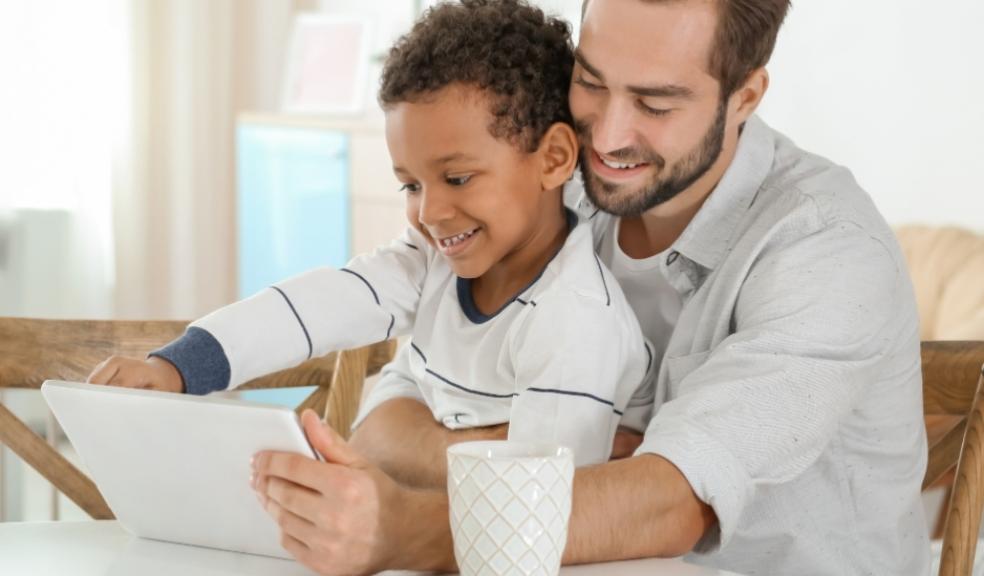 parent and child using a smart device together picture of a parent and child using a smart device together