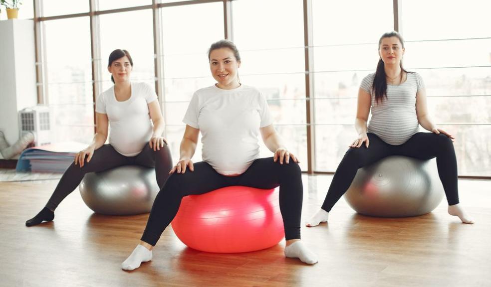 three women exercising while pregnant
