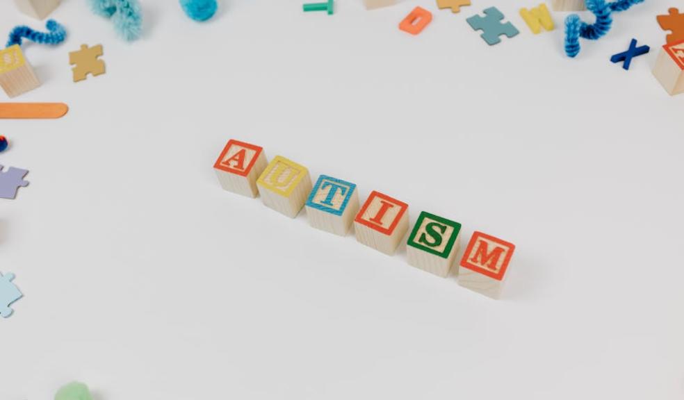 Autism spelt out in colourful letter tiles