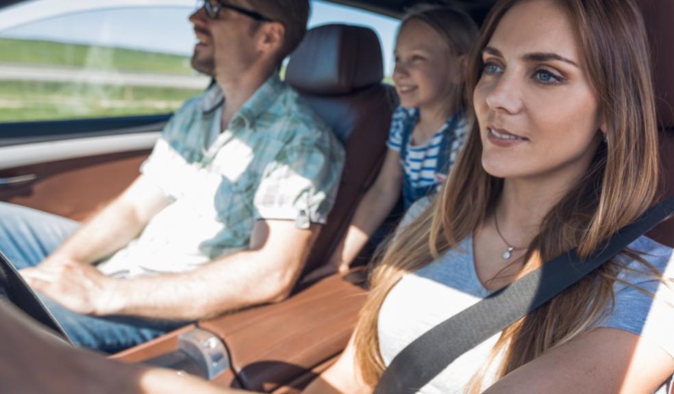 picture of a family in a car