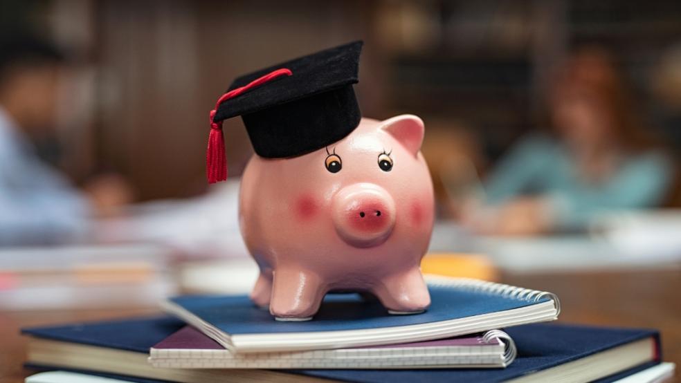picture of piggy bank with student cap on