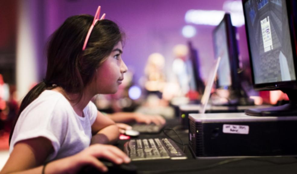 picture of a child gaming at power up event