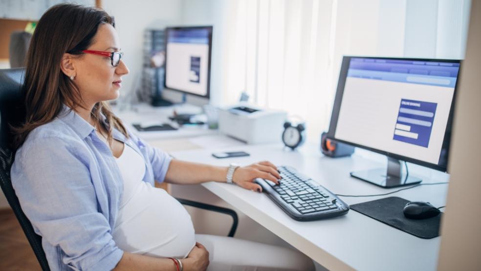 picture of pregnant woman at work