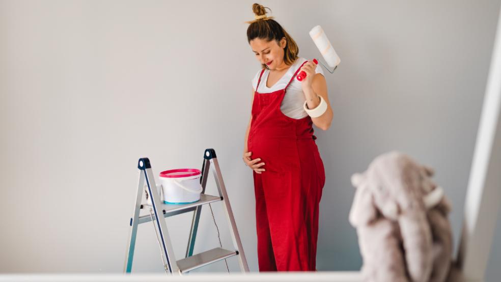 picture of pregnant woman decorating