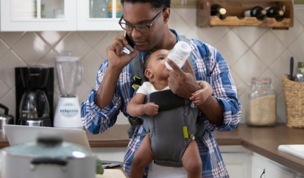 picture of a single parent looking after child and working out finances