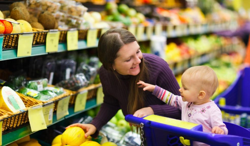 Picture of a mum and her baby in a supermarket