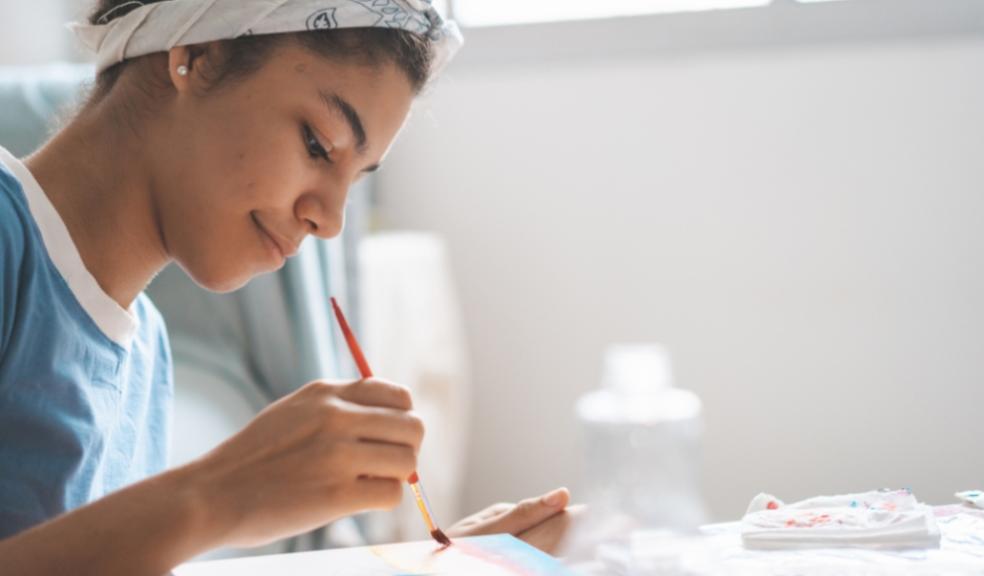 picture of a teen doing art in school