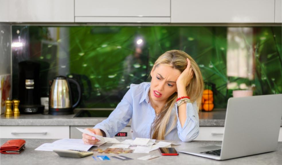 picture of a woman struggling with bills
