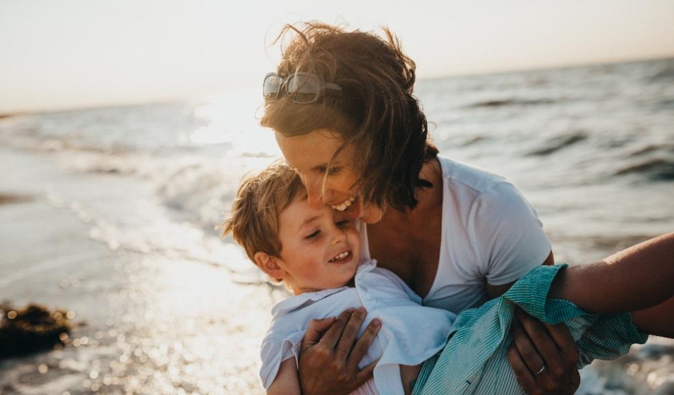 picture of a mum and her son at a sunny beach