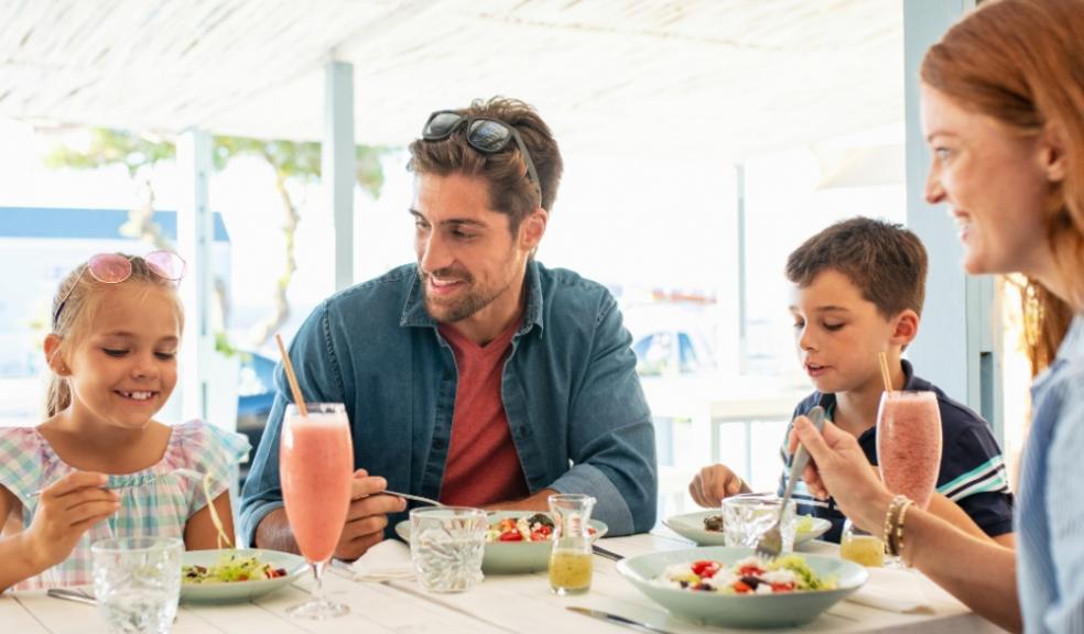 Young family eating out in a restaurant