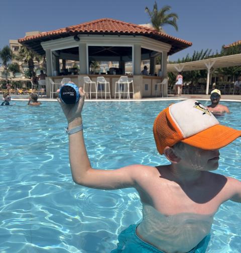 picture of a child in the pool with the waboba pro swimming ball
