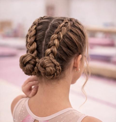 a tween gymnastic with dutch hair braids into a bun for gymnastic competition hair picture of a tween gymnastic with dutch hair braids into a bun for gymnastic competition hair