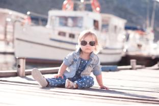 picture of a trendy baby on a dock