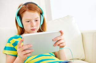 picture of a child looking at a tablet device