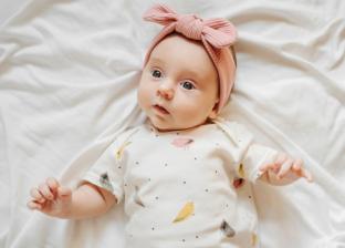 picture of a baby with a pink headband