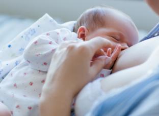 picture of a baby breastfeeding
