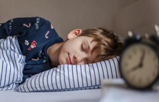 picture of boy asleep in bed