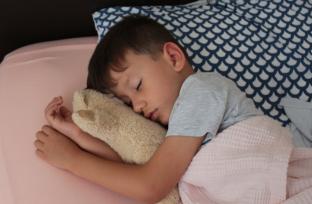 picture of boy asleep in bed