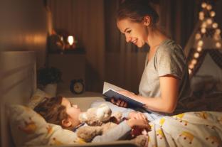 picture of mum reading a bedtime story to a child