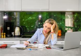 picture of woman struggling with bills