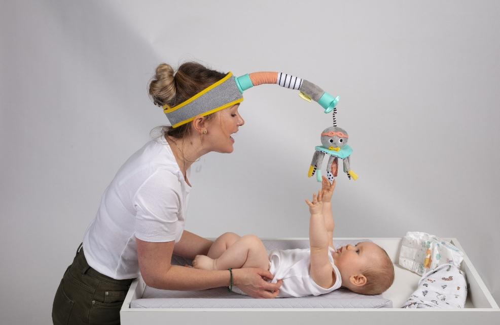picture of a mum and baby with Dingle Dangle toy