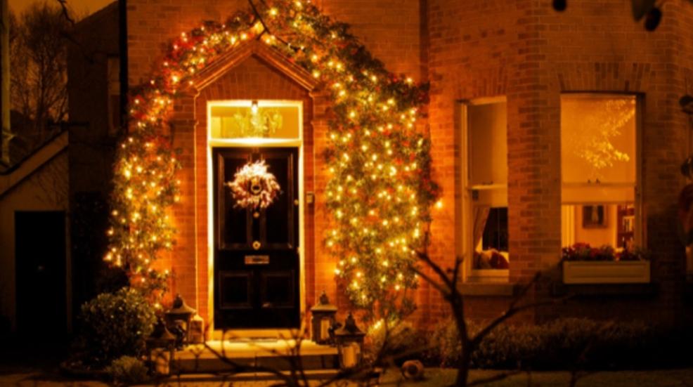 picture of a front door lit up with christmas lights