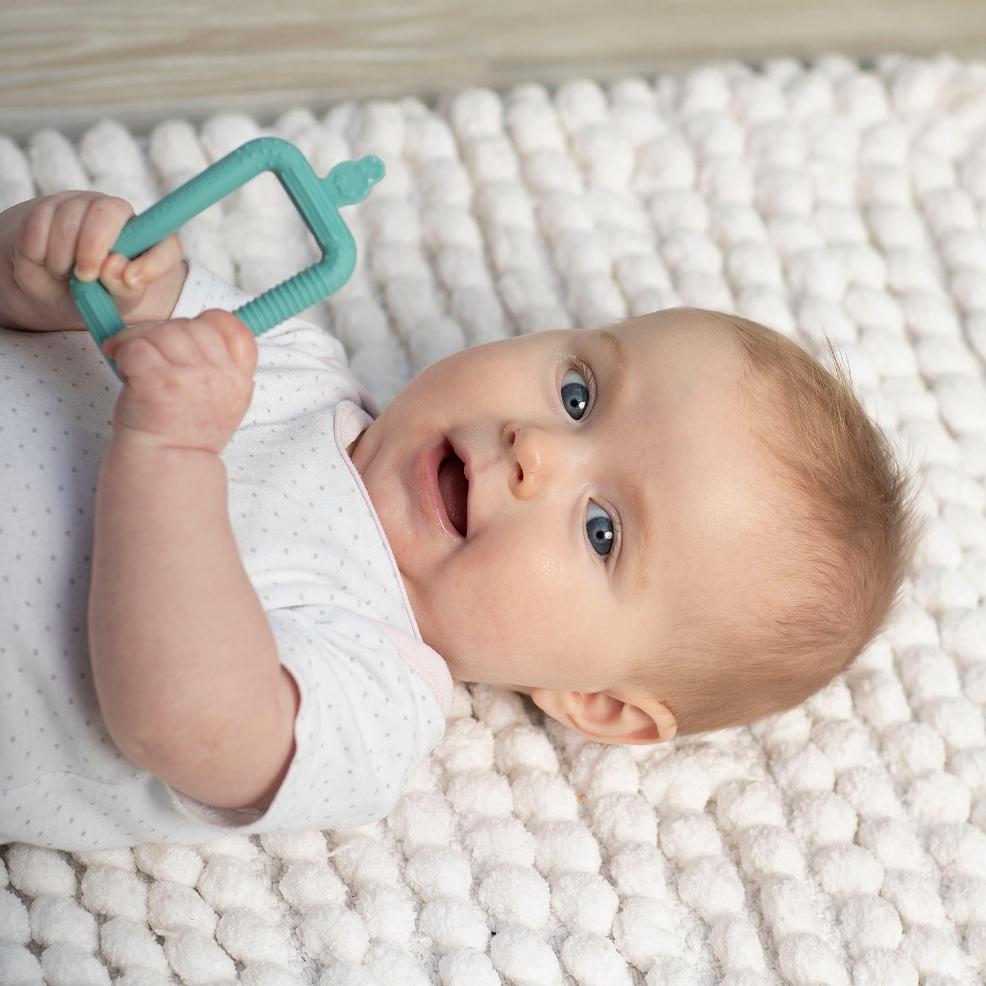 picture of a baby with a cheeky chompers flexi brush
