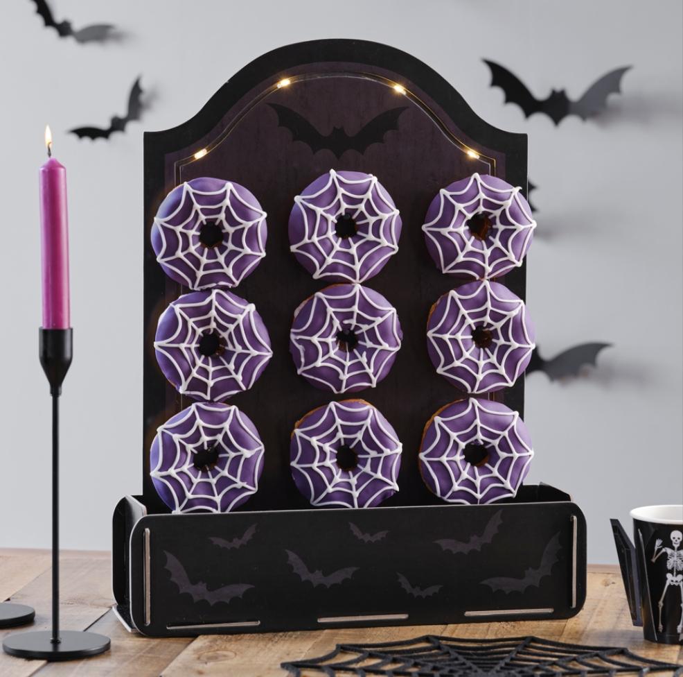 picture of Halloween tombstone donut stand with treat bucket and lights