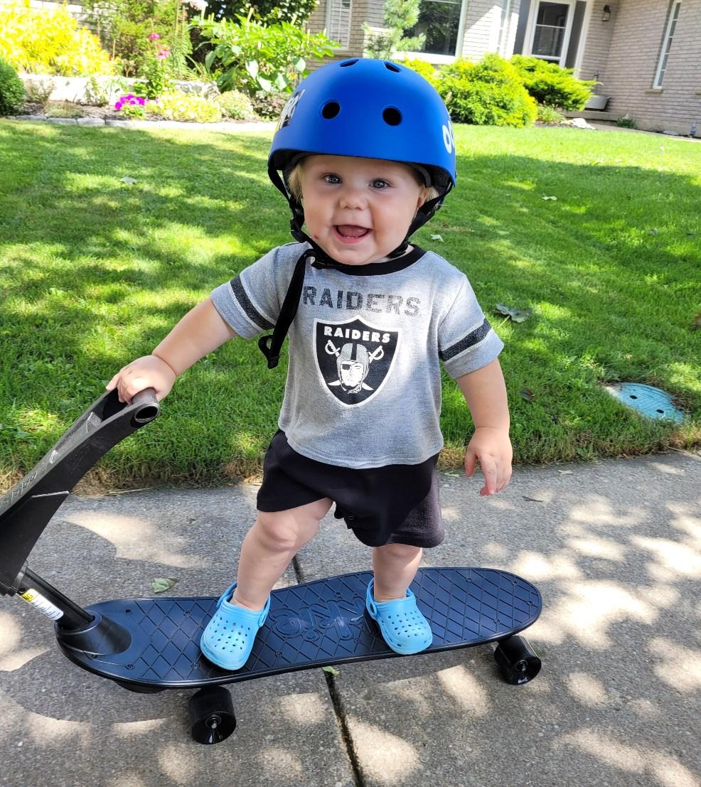 picture of a toddler on an ookkie skateboard