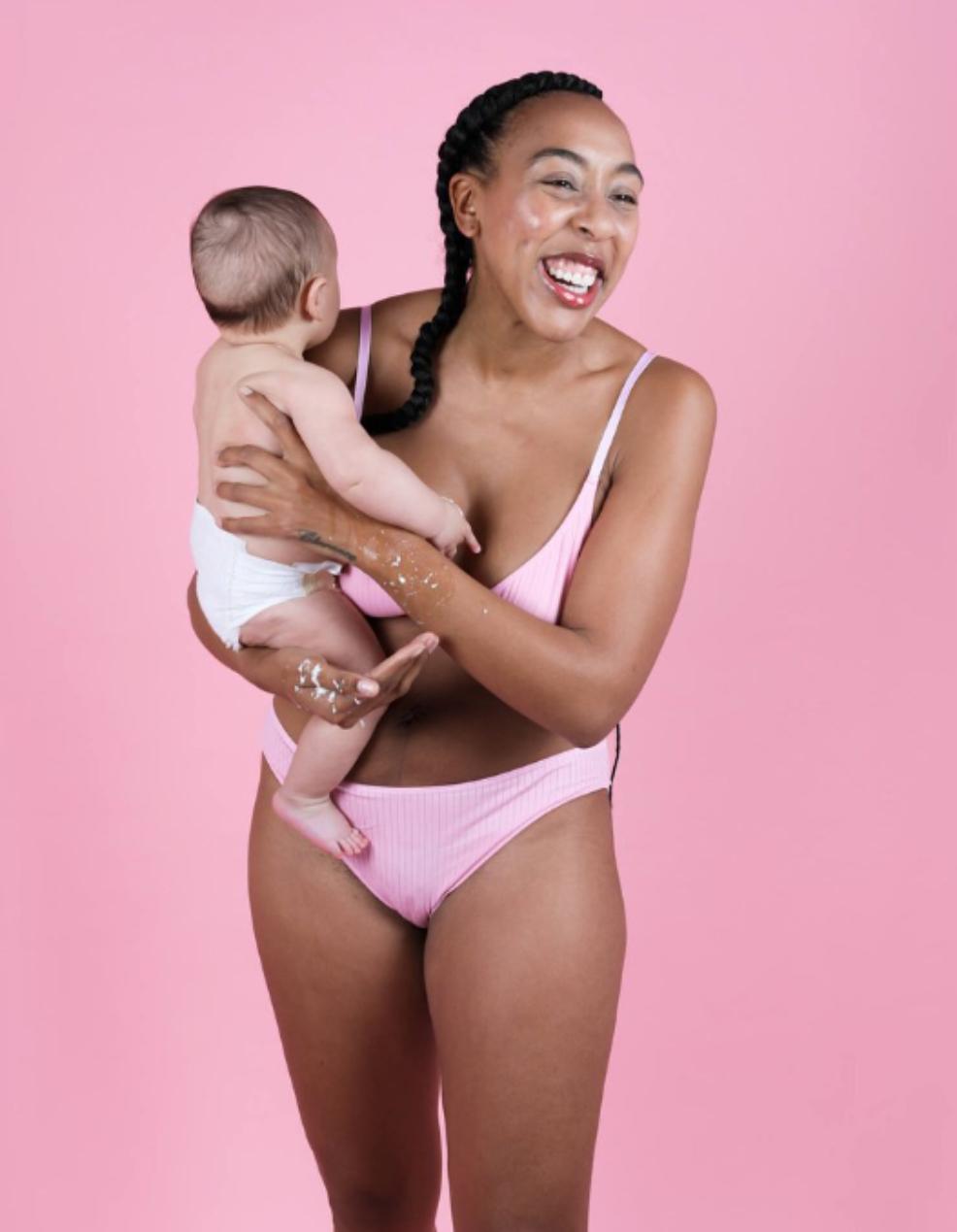 picture of a happy mum holding a baby