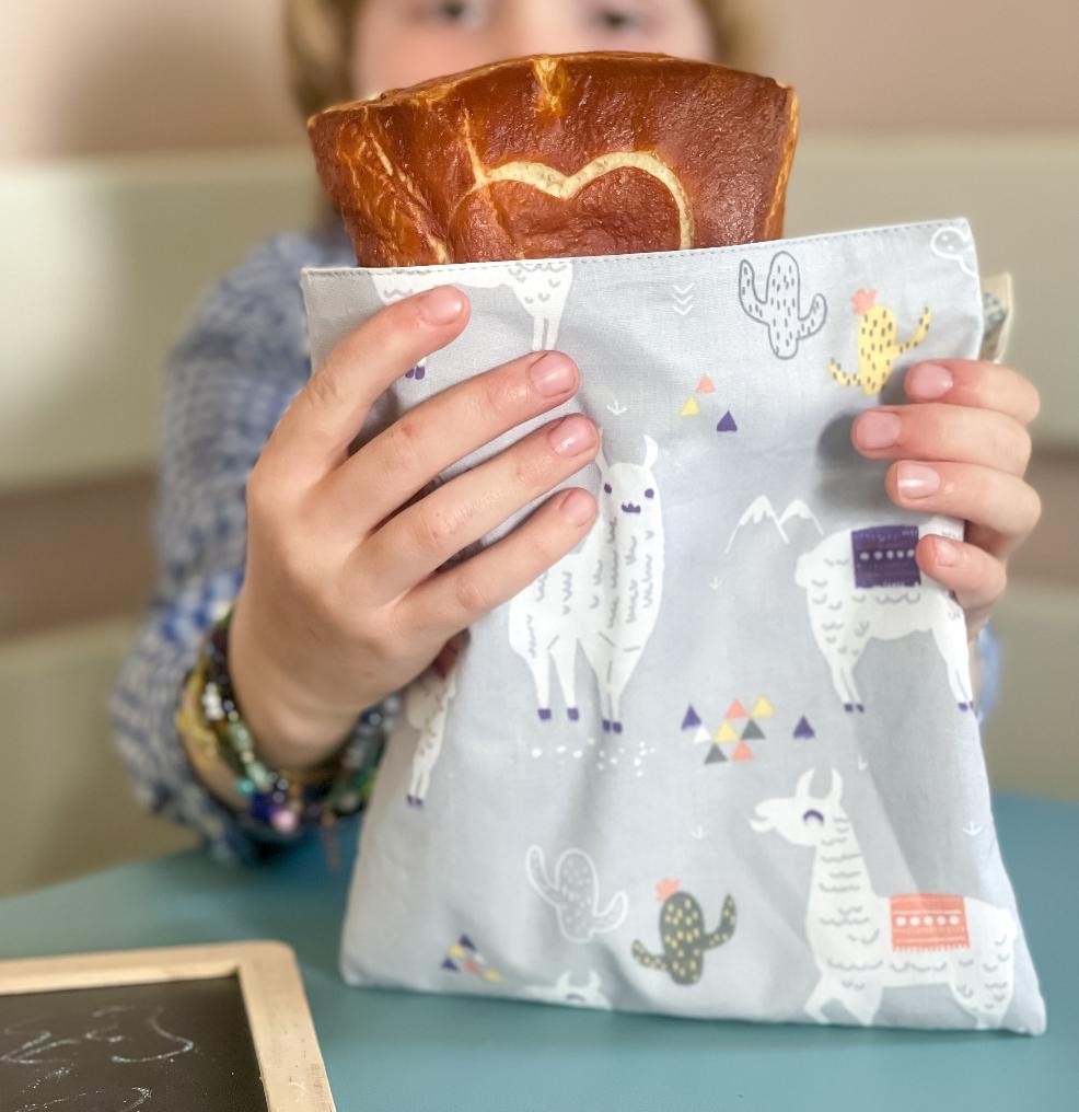 picture of a child with a zero waste snack bag