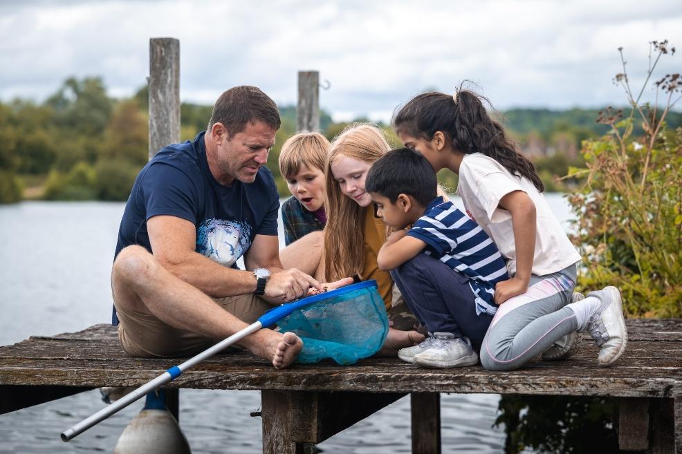 picture of Steve Backshall pond dipping with children