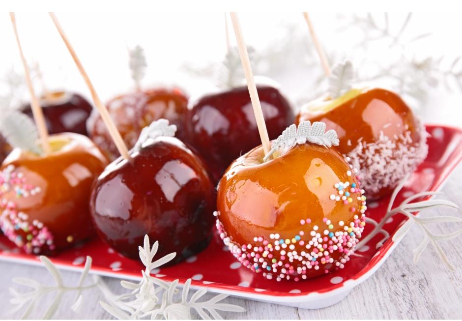 picture of some toffee apples with sprinkles on
