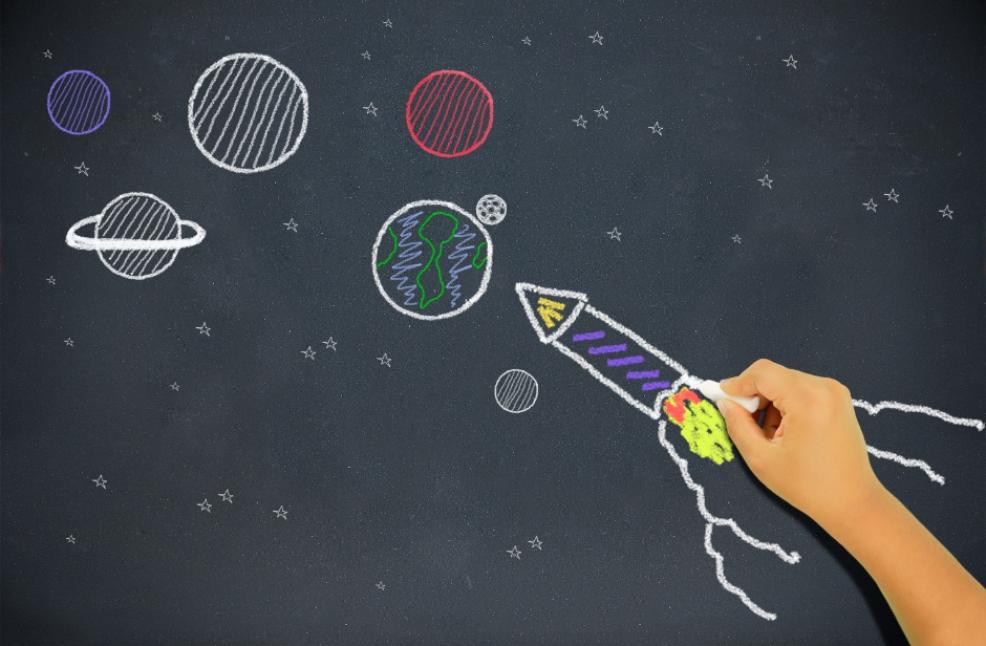 Picture of a child's drawing of a rocket going up into space