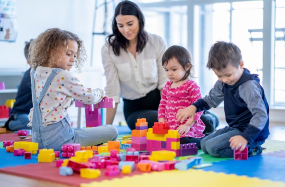 picture of teacher and children in a childcare setting
