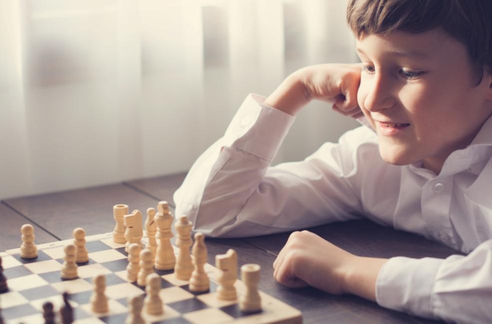 picture of a child playing chess