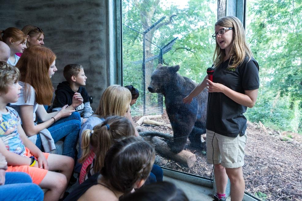 picture of children and a bear at the wild place project