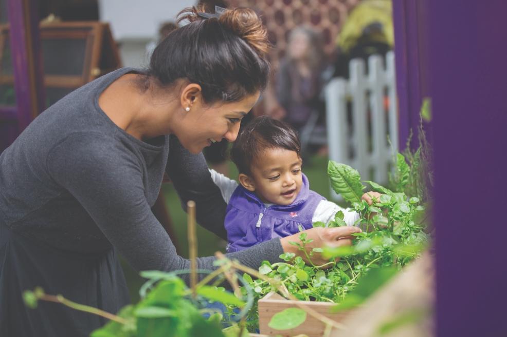 picture of mother and child looking at plants at we the curious museum