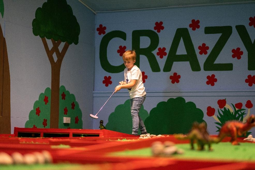 picture of child playing dino crazy golf at moonfleet manor in dorset
