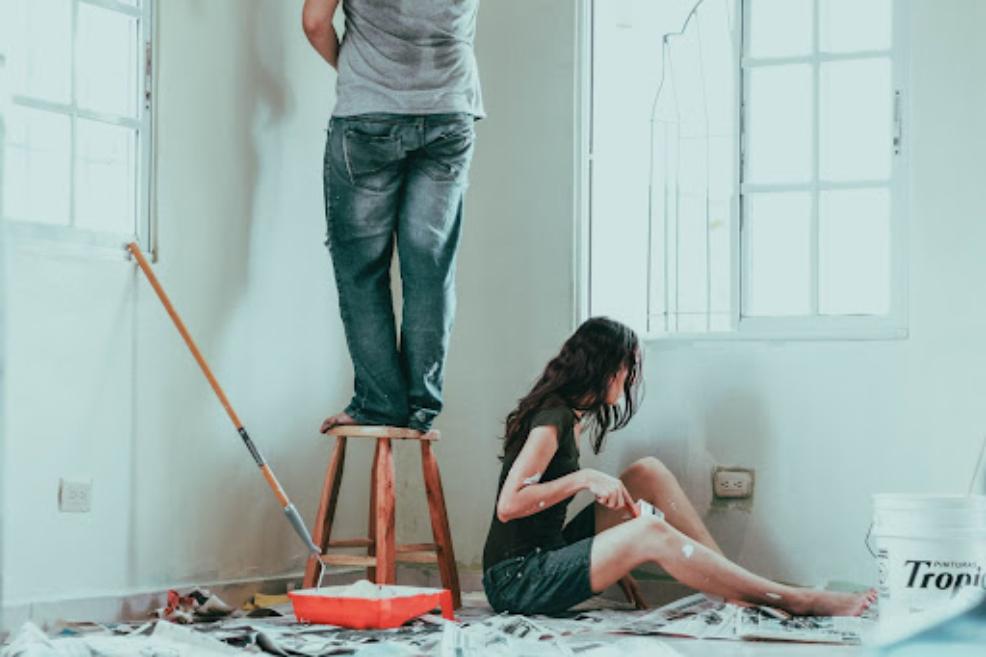 picture of a couple painting a room