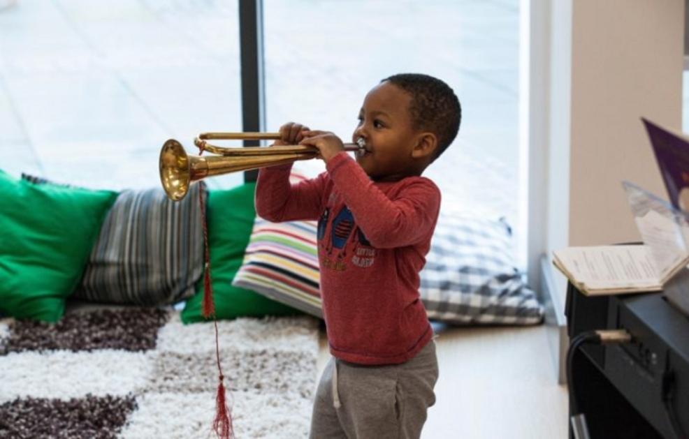 picture of a child playing the trumper