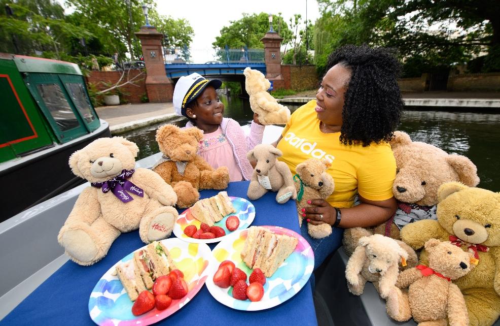 picture of a family on a boat with teddy bears