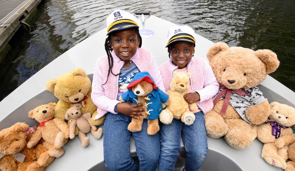 picture of a family on a boat with teddy bears