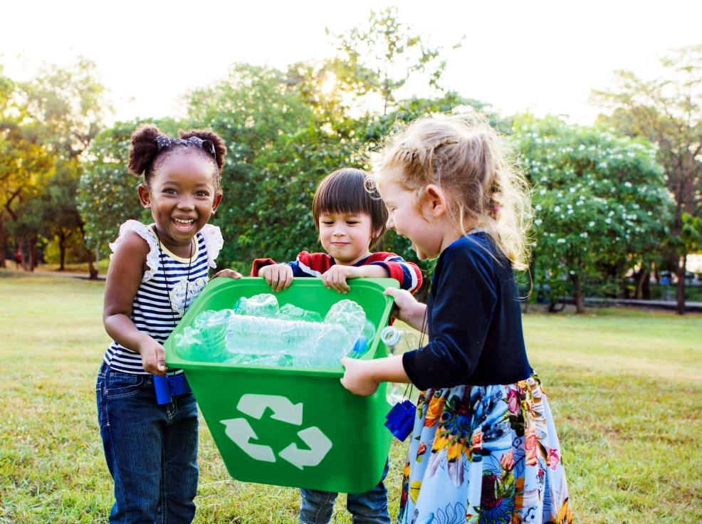 picture of happy children recycling