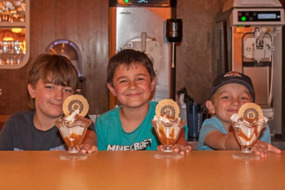 picture of 3 boys with ice cream sundaes